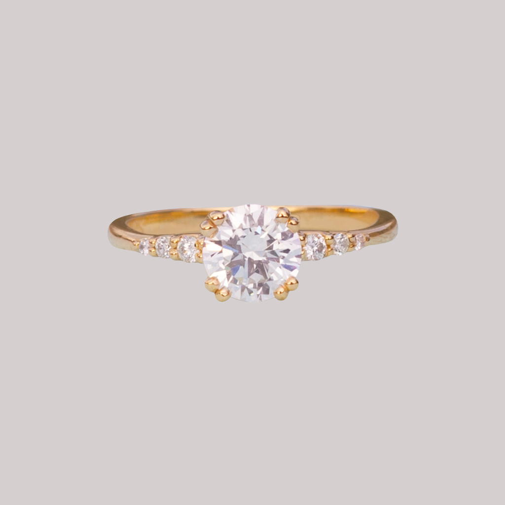 Delicate solitaire diamond engagement ring, set with four double prongs, made in 14k or 18k yellow gold