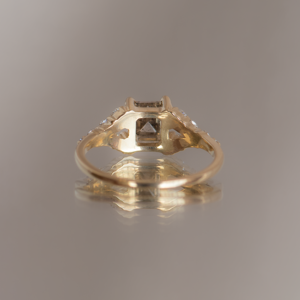  Emerald cut salt and pepper diamond engagement ring with split band, made with rose cut diamonds in 14k yellow gold.