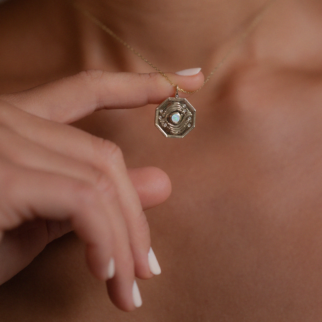 Gold and opal geometric charm