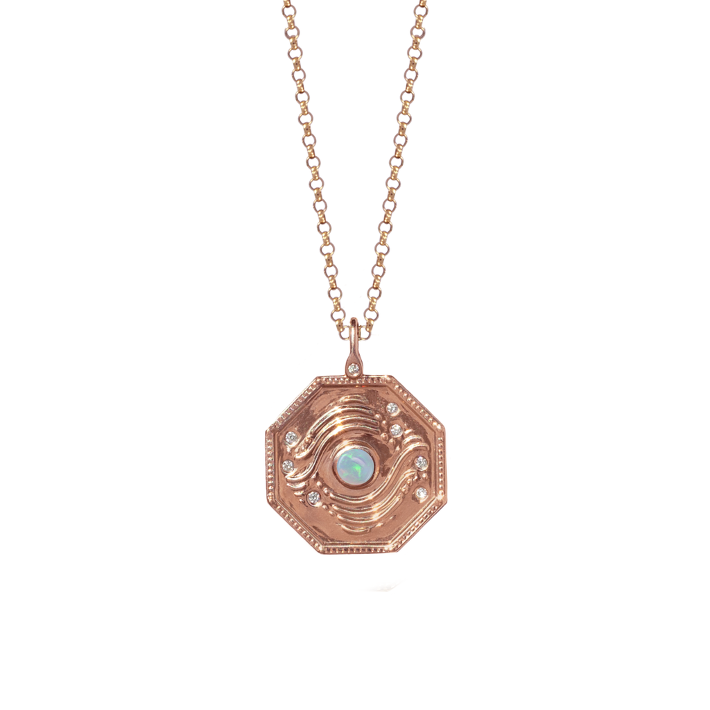 gold talisman with opal