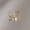 Delicate dangle wedding band, with chevron contour to trace and pair with any engagement ring, whether it’s a solitaire or a halo. This ring is also a perfect everyday stackable ring that can be stacked with your favourite everyday staples, or worn on its own. Made in 14K gold.