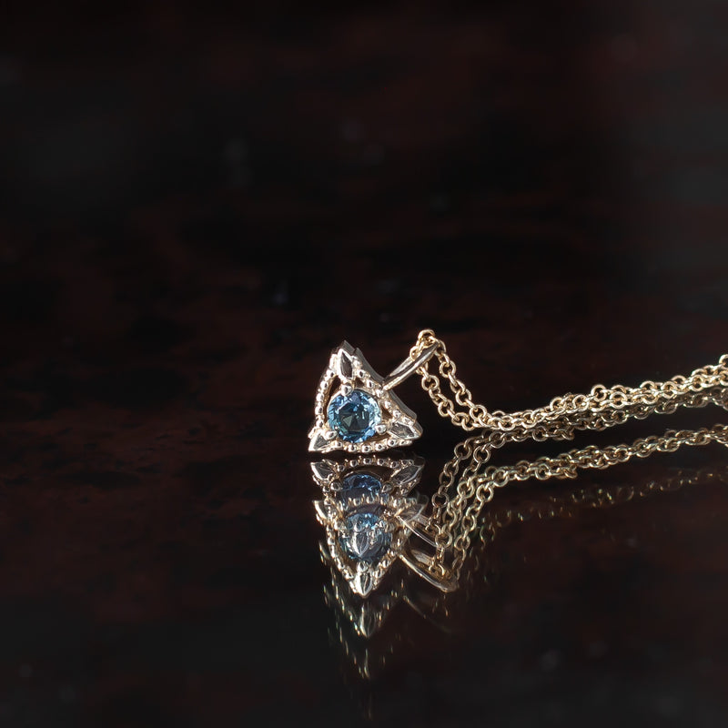 Sapphire trillium gold charm