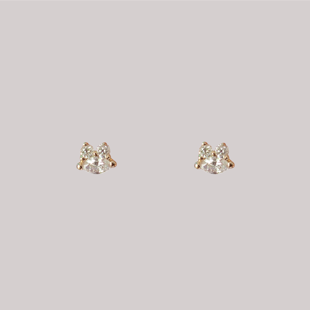 Diamond marquise dainty gold studs, made in solid 14k yellow gold.