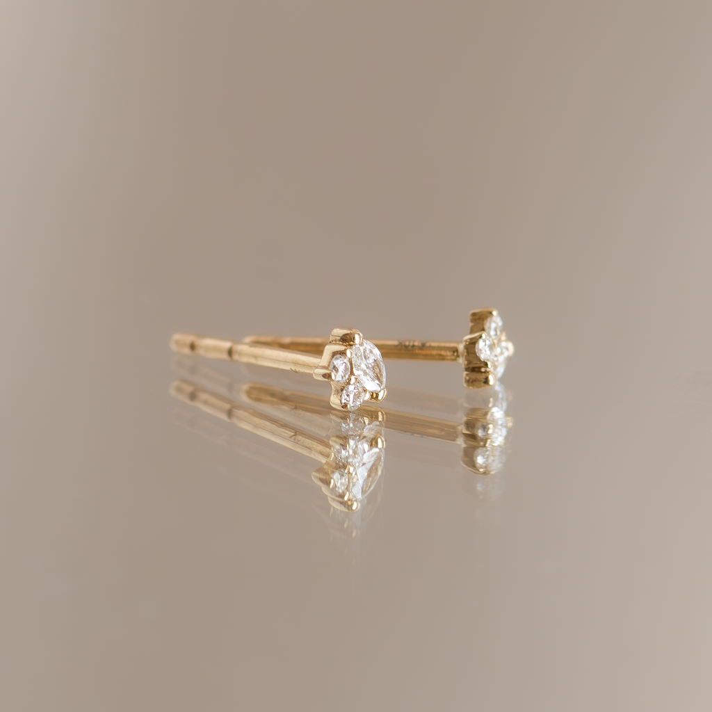 Marquise diamond earring studs, made in 14k gold.