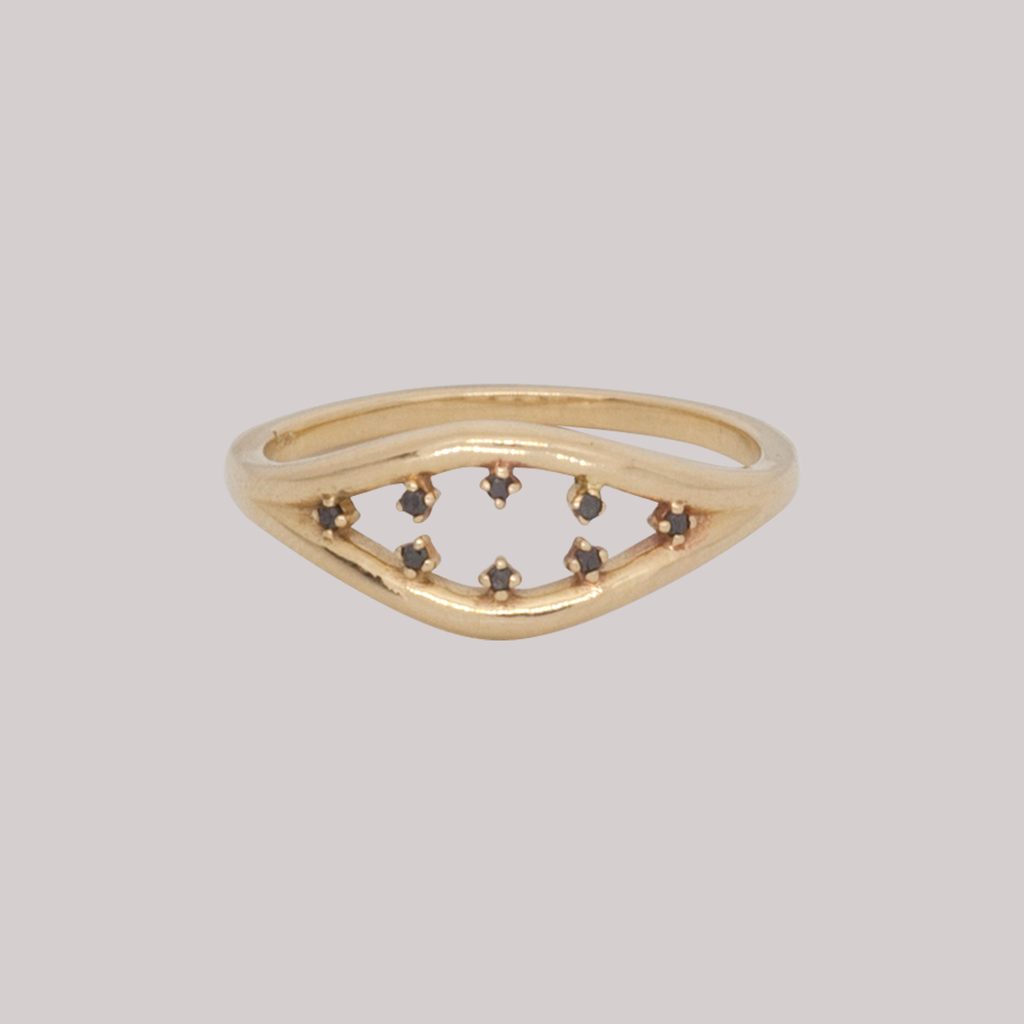 Inspired by the evil eye, split double band everyday gold ring with black diamonds, made in 14k or 18k gold.