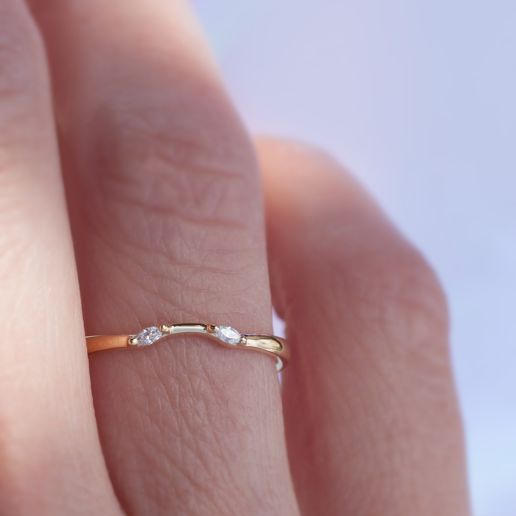 Delicate diamond contour band has a gentle wave design to trace and pair with any engagement ring, whether it’s a solitaire or a halo. This ring is also a perfect everyday stackable ring that can be stacked with your favourite everyday staples, or worn on its own. Made in 14k solid gold.