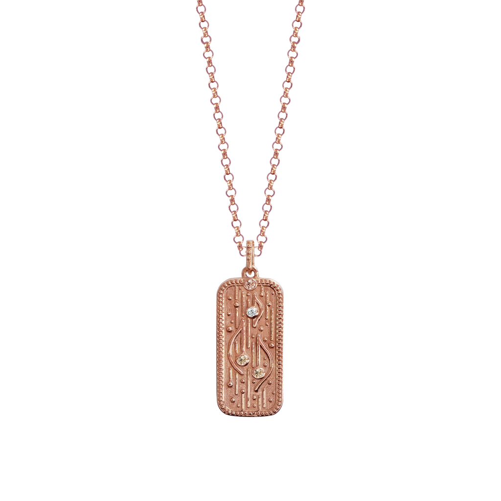 Rose gold amulet with diamonds.