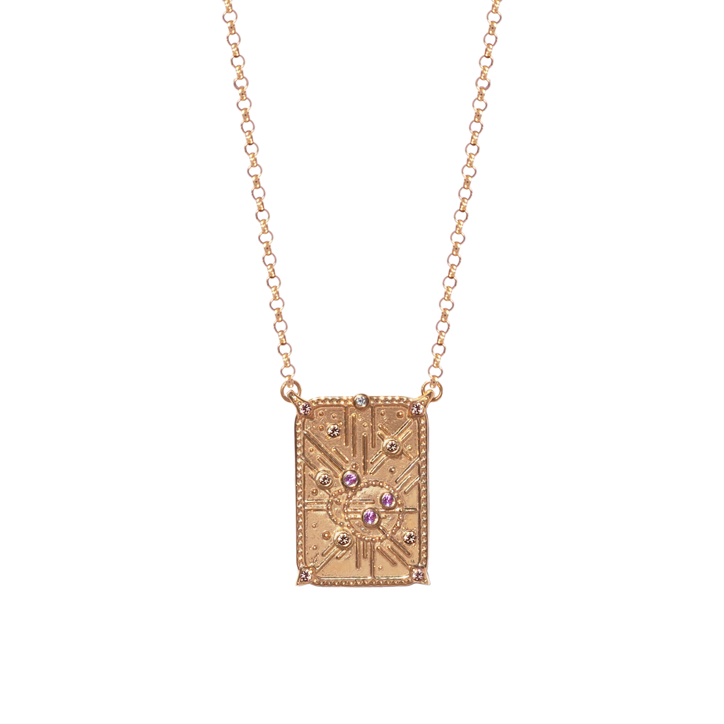 Light code charm, with sacred geometry, made in 14k or 18k gold, with light pink sapphires and champagne diamonds. 