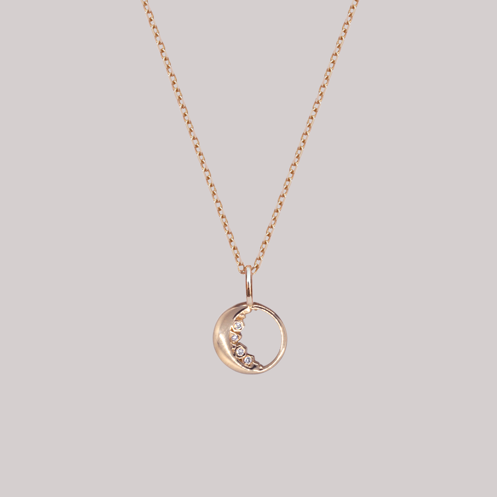 Crescent moon charm with diamonds 